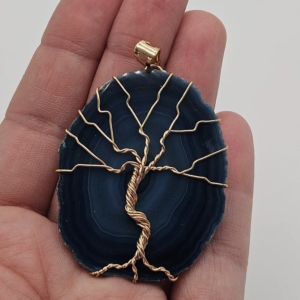 blue agate slice pendant with gold tone wire tree of life